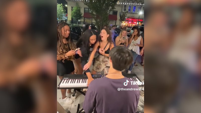 A woman was caught on camera disrupting a UGA student's street performance.