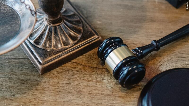 File photo of gavel and scales of justice.