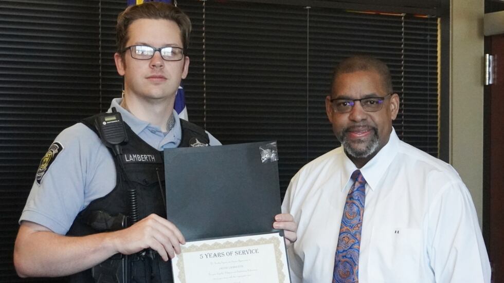 Jacob Lamberth (left) receives his five-year service recognition from Richmond County Sheriff...
