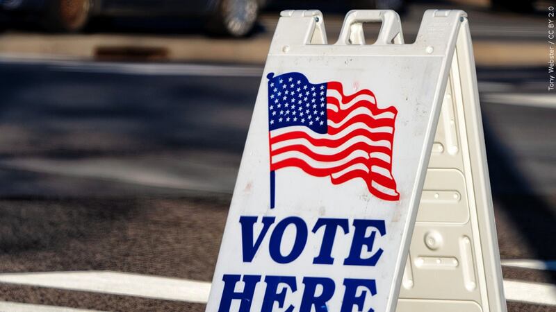 A "Vote Here" sign sits in front of an election site in Nov. 2020.
