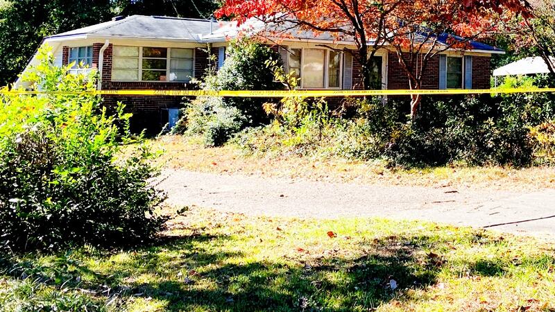 Crime scene tape blocks a Jackson home after a man's body was found in a cellar. His hands and...