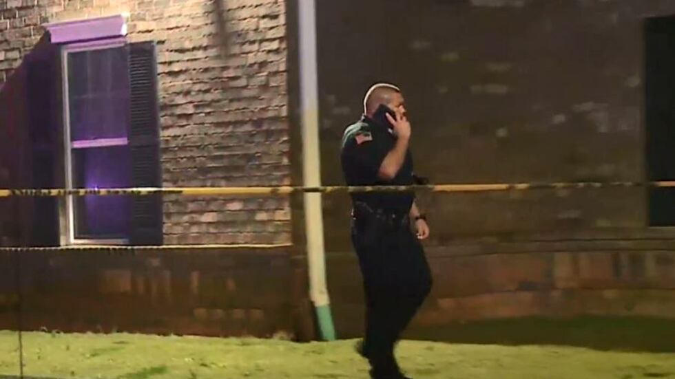 Officers investigate a deadly shooting on Nov. 29, 2020, at the Palmetto Crossing Apartments...