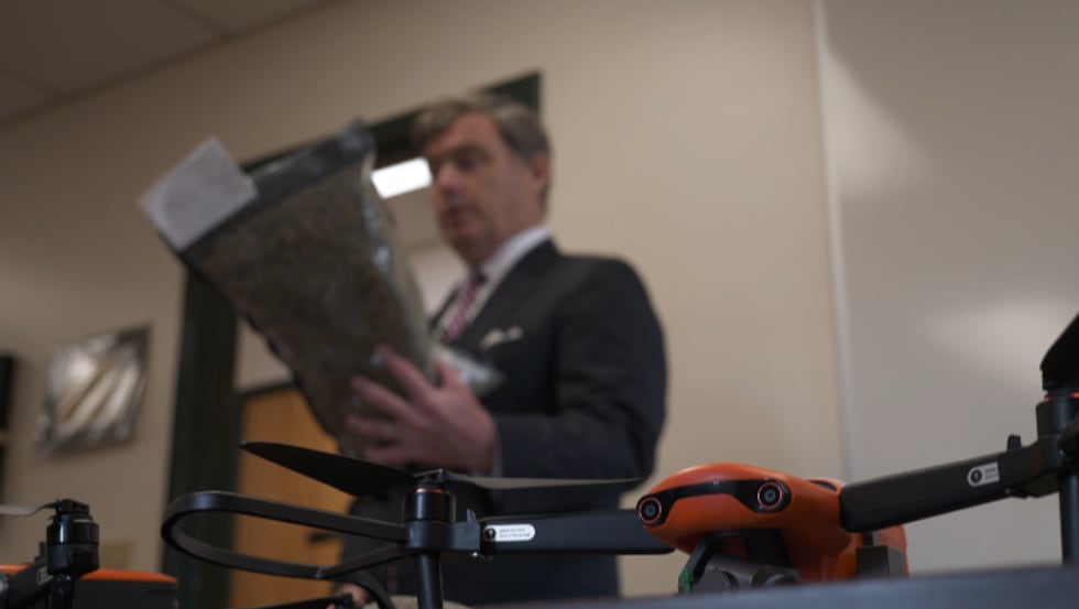 SCDC director Bryan Stirling holds a bag of confiscated weed, caught after an unsuccessful...