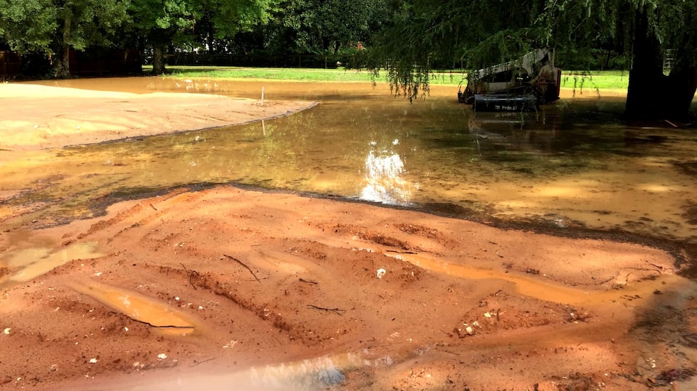 Mud could be seen on Walker Avenue Southeast and Grace Avenue on Monday after storms moved...